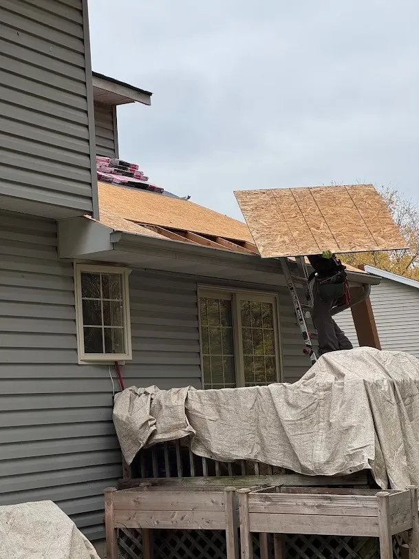 Roof deck exposed during a tear-off, checked for rot before new shingles