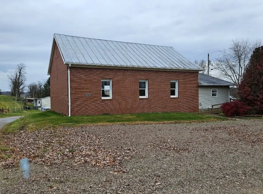 Brick building with a new metal roof