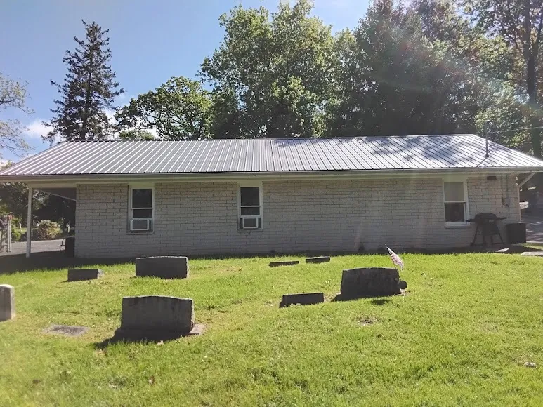 Single-story ranch home with a metal roof