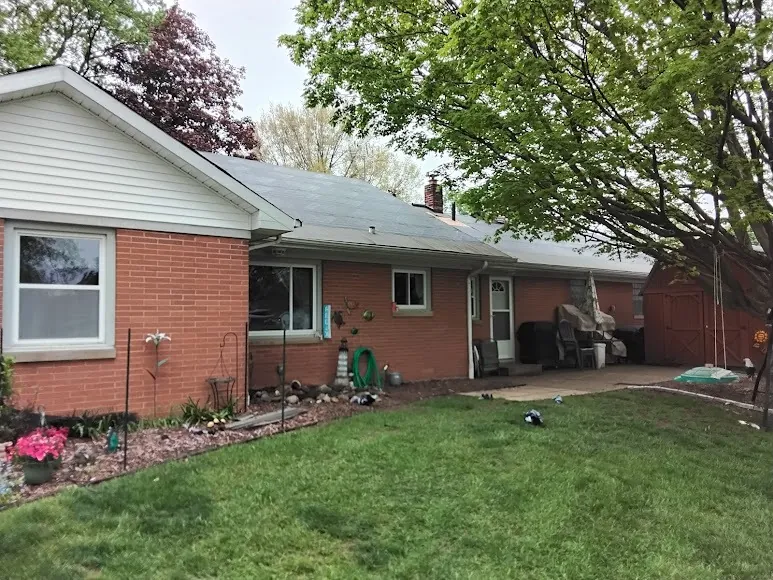 Soffit and fascia along the eaves of a brick home, where a hidden roof leak can drip out